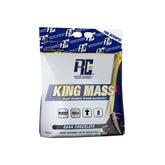 A package of Ronnie Coleman King Mass XL 15lbs dark chocolate flavor, highlighting its super abnormal growth accelerator properties.